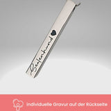 Kette mit Hundenamen und Pfotensymbol