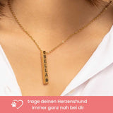 Kette mit Hundenamen und Pfotensymbol